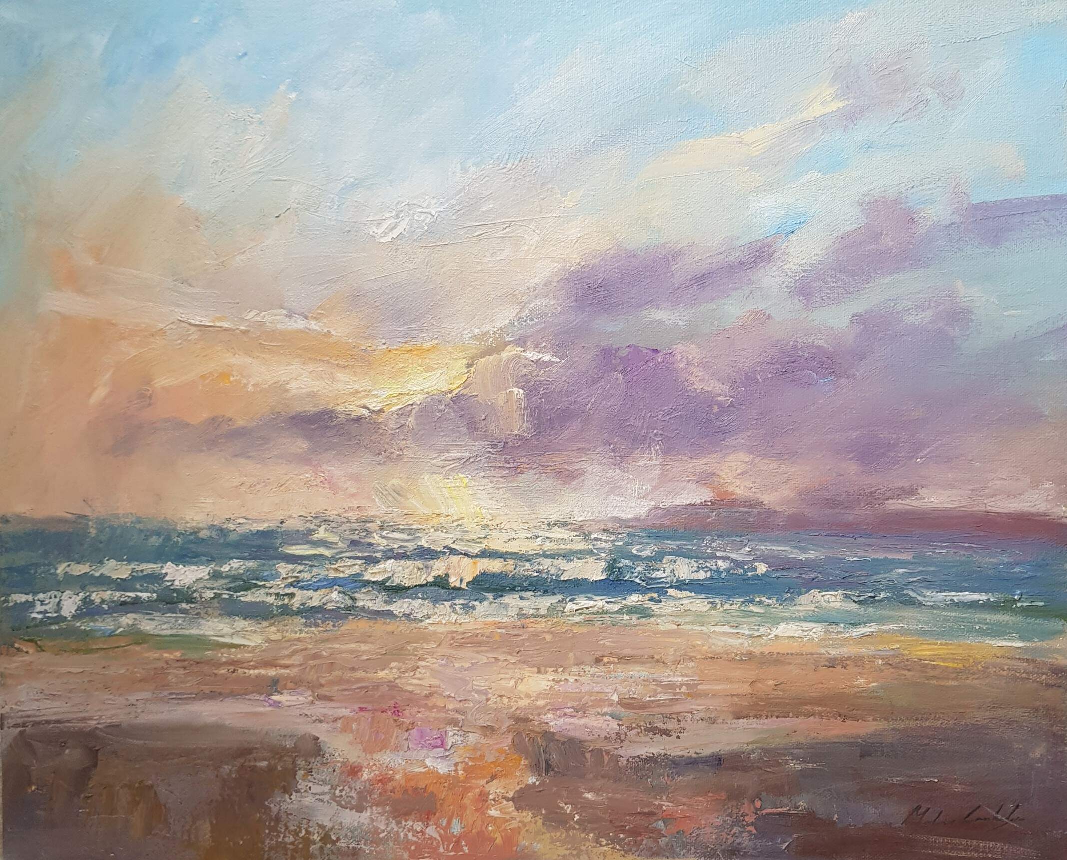 Sunlit surf breaking onto West Wittering beach under an evening sky